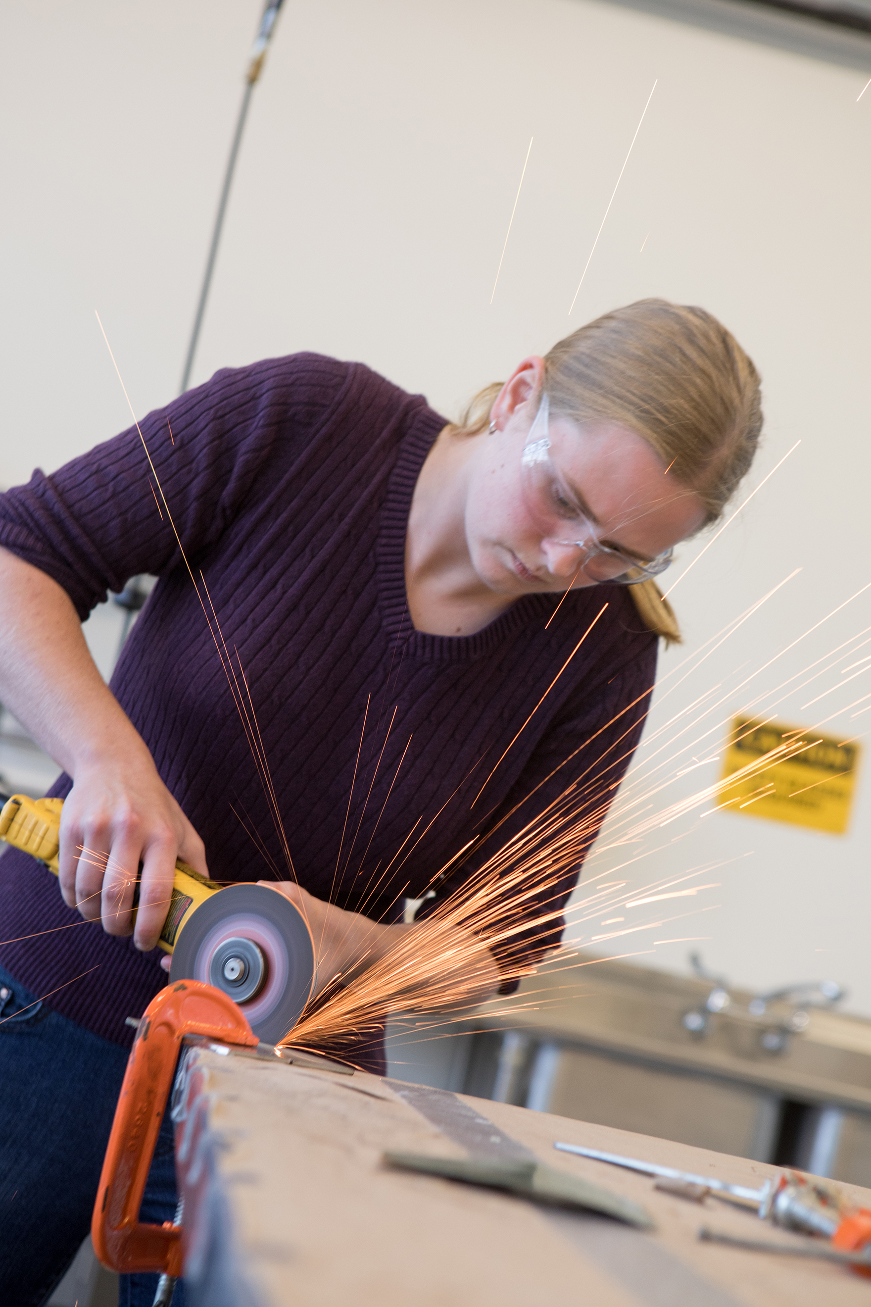 A student works with a saw