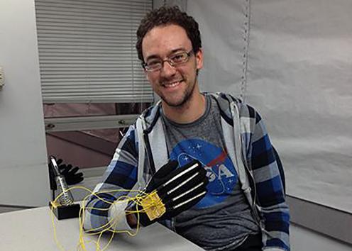 SEDS student with a glove connected to sensors